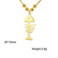 Collier Poisson Squelette Doré à Billes, dimensions 25×10 mm, affichant le poids de 3,9 g sur fond blanc.
