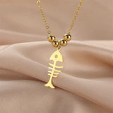 Collier Poisson Squelette Doré à Billes
