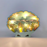 Décoration Lumineuse Coquillage en Bois éclairée, dévoilant un univers marin découpé avec coraux et poissons