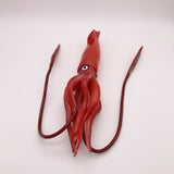 Figurine Calamar Rouge posée à plat, mettant en évidence ses longs tentacules et sa coloration vive.