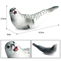 Figurine Phoque Blanc en résine, avec un pelage tacheté et une expression souriante, idéale pour la décoration ou la collection