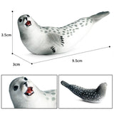 Figurine Phoque Blanc en résine, avec un pelage tacheté et une expression souriante, idéale pour la décoration ou la collection