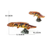 Figurine Poisson Polypterus Delhezi mesurant environ 16,8 cm de long, 4,4 cm de large et 5,8 cm de haut, posée sur un socle rocheux.
